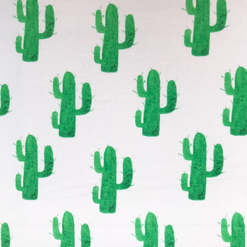 Coupon 130 / French terry - Groene cactussen op wit