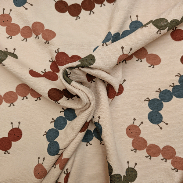 Terry crepe - Rupsjes op lichtbeige